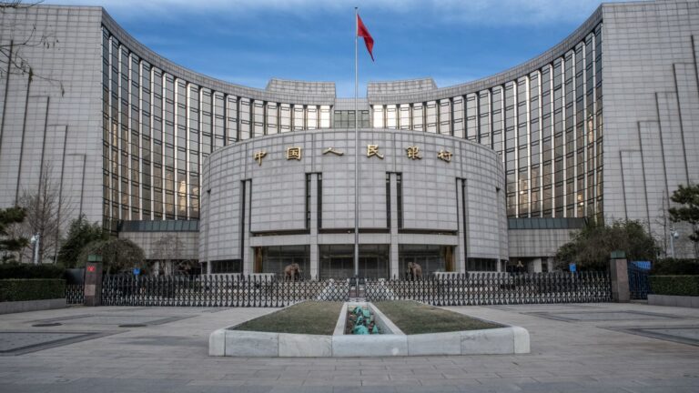 China holds its benchmark lending rates as Beijing assesses stimulus measures